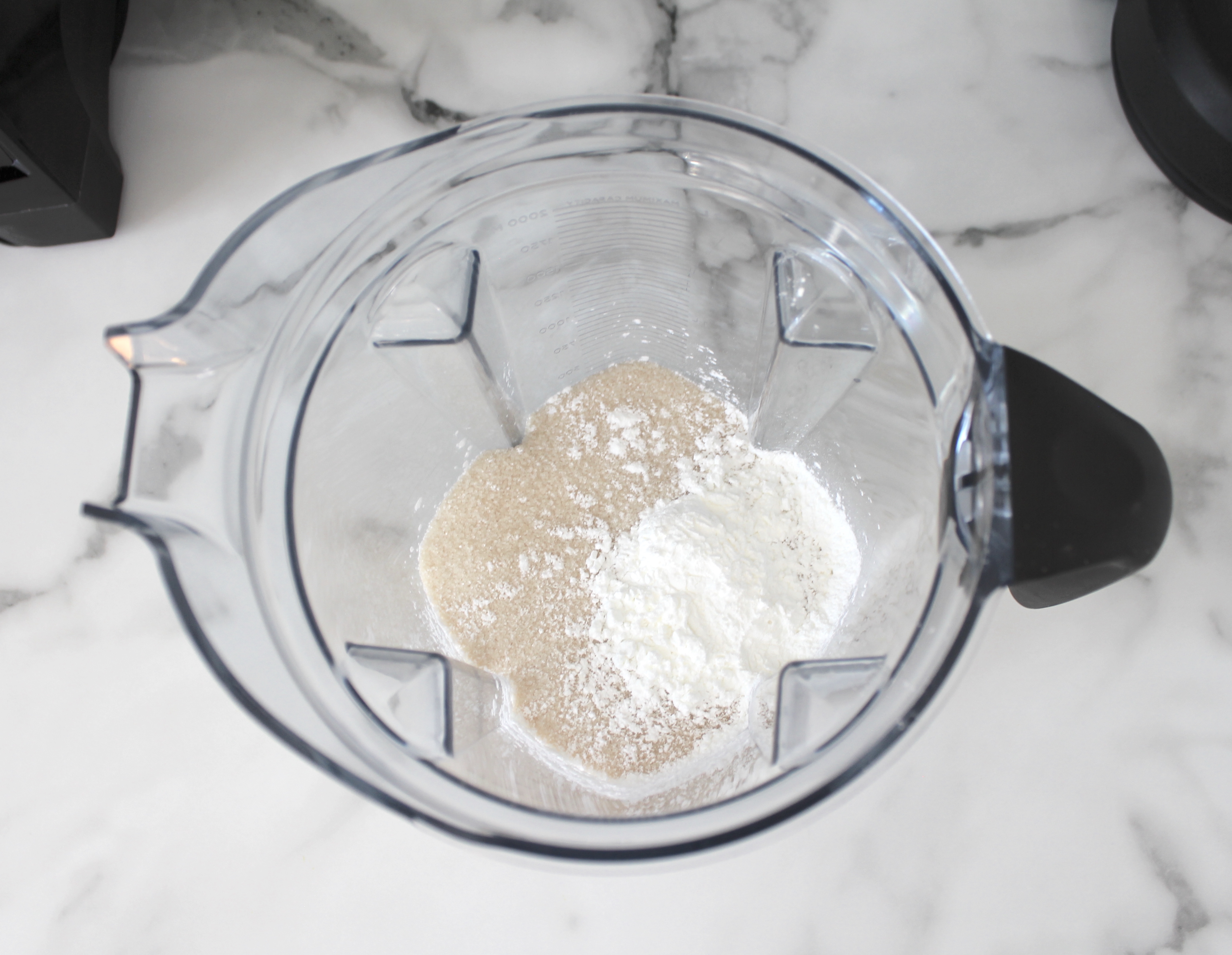 Vitamix blender with sugar and corn starch.